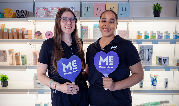 Two ME employees smiling