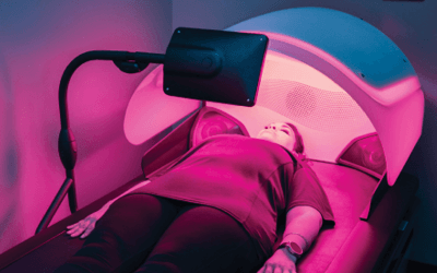 Woman lying down during HyrdoWave Custom Massage service. 