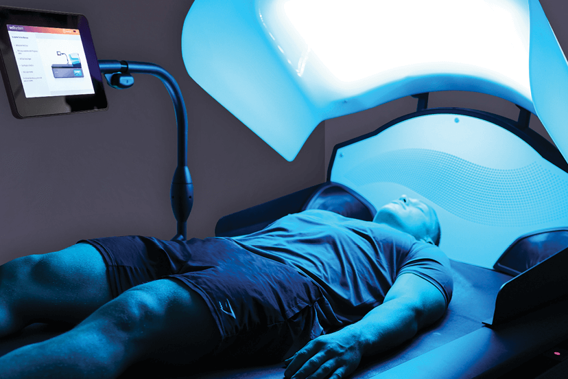 Man relaxing during HydroWave custom massage sessions at Massage Envy. 