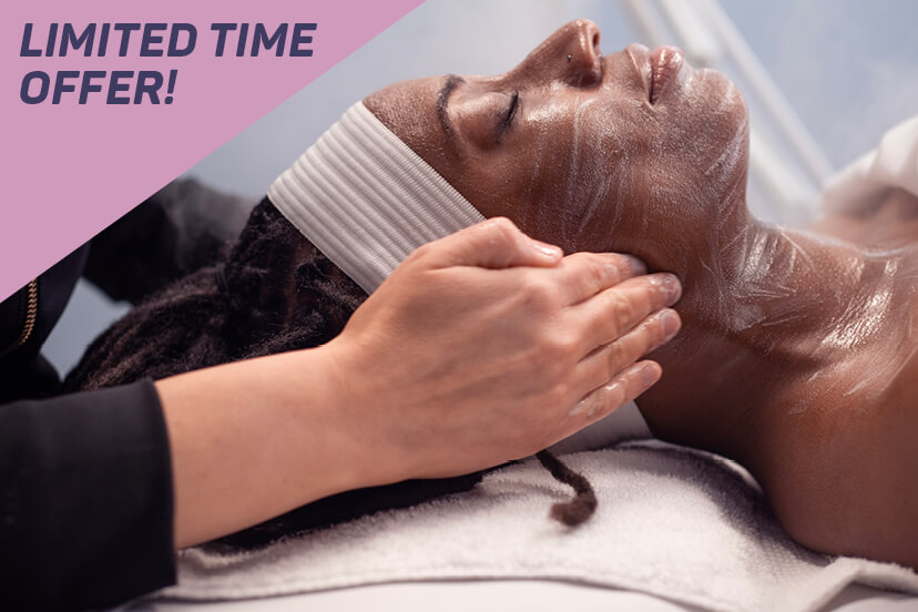 Limited Time Offer! Woman relaxing with her eyes closed as esthetician massages her neck. 