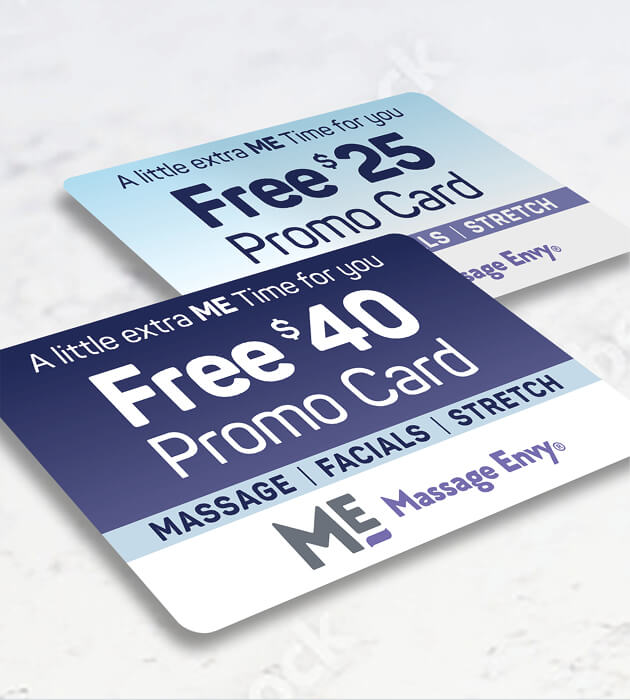 Close-up of two Massage Envy promo cards. 