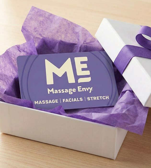 Massage Envy gift card inside of a box. 
