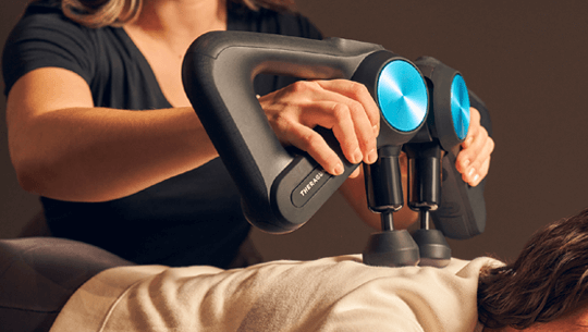 Woman laying down for rapid tension relief service from Massage Envy therapist. 